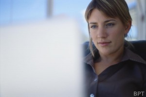Businesswoman sitting in front of a computer